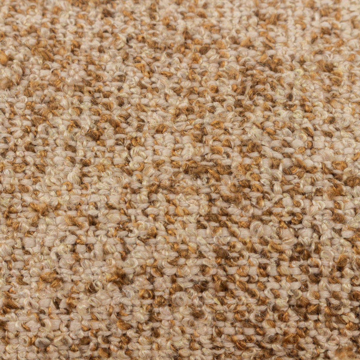 Close-up of the Doze Reversible Cotton Cushion in Biscuit, showing a space-dyed woven texture blending beige, toffee and golden-brown flecks.