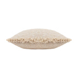 Doze Reversible Cotton Cushion in natural, a rectangular bolster with a nubbly, two-tone cream and sandy beige weave and raw fringed edge trim, shown on a plain white background.