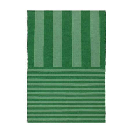 Deck Stripe Printed Polyester Rug in green, flatweave design with bold vertical stripes shifting to narrower horizontal lines at one end, shown on a plain white background.