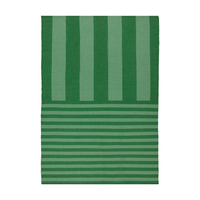 Deck Stripe Printed Polyester Rug in green, flatweave design with bold vertical stripes shifting to narrower horizontal lines at one end, shown on a plain white background.