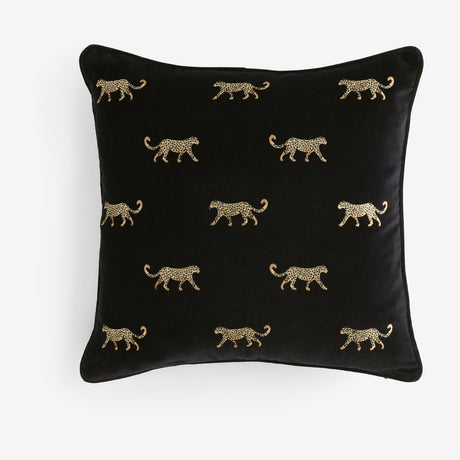 Duma Velvet Cotton Cushion in noir, a square black velvet cushion with embroidered gold cheetahs in a repeating pattern, shown on a plain white background.