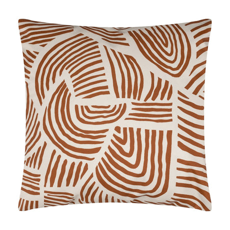 Dunes Reversible Polyester Cushion in brick, a square design with cream swirling line patterns resembling sand ridges, shown against a plain white background.