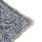 Durelle Damask Cotton Cushion in Delph Blue, close-up of the folded corner showing the scrolling floral damask print and raw speckled fringed edge on cotton, plain white background.