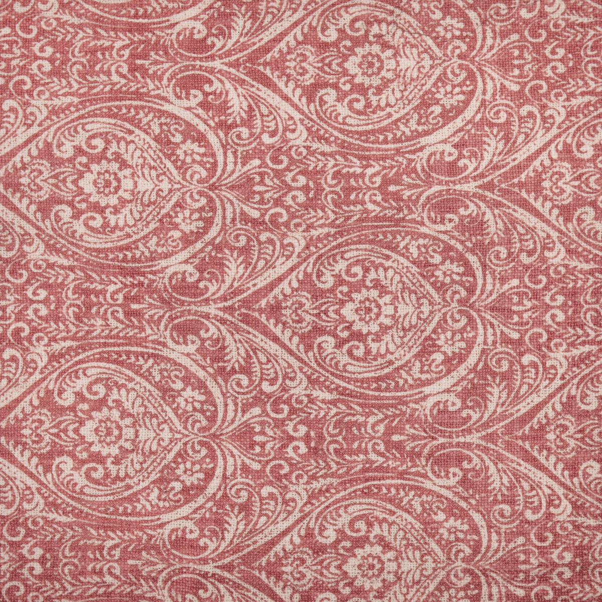 Durelle Damask Cotton Throw in coral, showing a swirling paisley and floral pattern printed on cotton against a cream ground.