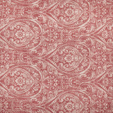 Durelle Damask Cotton Throw in coral, showing a swirling paisley and floral pattern printed on cotton against a cream ground.