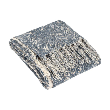 Durelle Damask Cotton Throw in Delph Blue, folded to show its ivory-cream scrolling damask pattern and knotted fringe edge, on a plain white background.