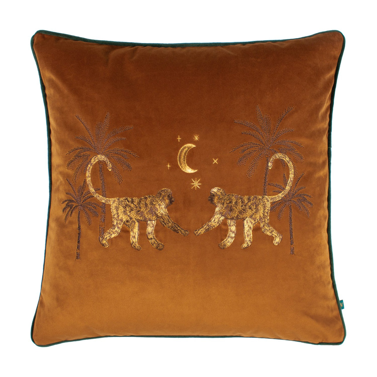 Dusk Animal Velvet Cushion in rust-orange velvet with embroidered facing monkeys, palm trees, crescent moon and stars in gold and brown thread, green piped edge, on a white background.