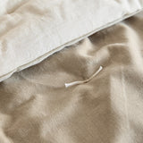 Close-up of the Edie quilted cotton velvet bedspread in natural, showing the tufted stitch detail and contrast between the soft velvet face and linen-look cotton reverse.