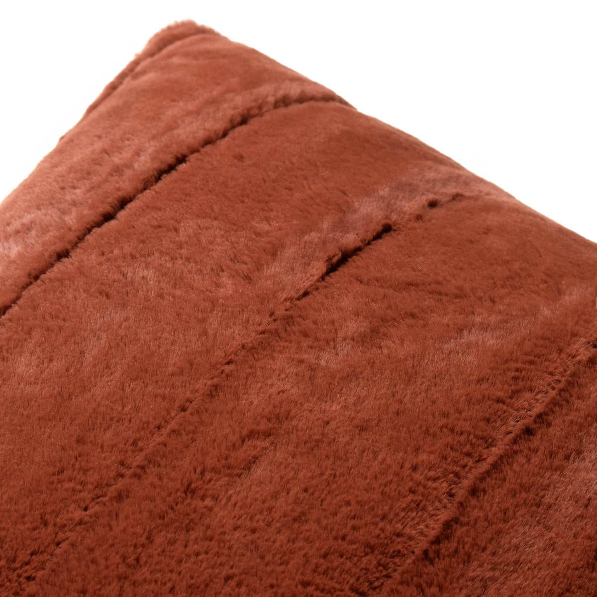 Close-up of the Empress Velvet Faux Fur Cushion in rust orange, showing deep pile texture with vertical ribbed channels, on a plain white background.