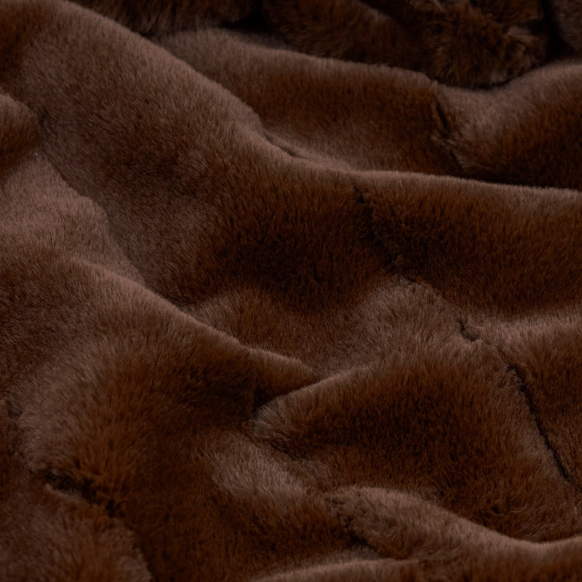 Close-up of the Empress Plain Faux Fur Throw in brown, showing dense, plush pile with soft folds and a rich, textured finish.