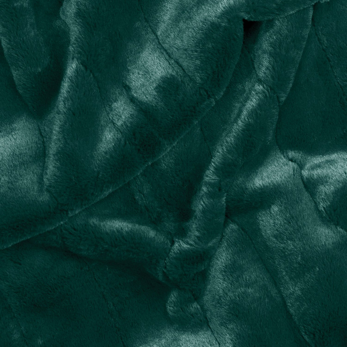 Empress Velvet Faux Fur Throw in emerald green, close-up of the soft, textured pile fabric with folded, rippling drapes.