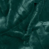 Empress Velvet Faux Fur Throw in emerald green, close-up of the soft, textured pile fabric with folded, rippling drapes.