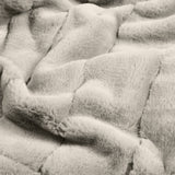 Close-up of the Empress Velvet Faux Fur Throw in grey, showing its deep, long-pile texture brushed into soft, channelled folds with a plush, pelt-like finish.