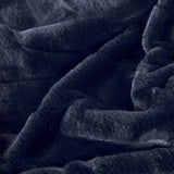 Empress Velvet Faux Fur Throw in navy, close-up of the plush, softly draped pile showing its deep blue tone and dense faux fur texture.