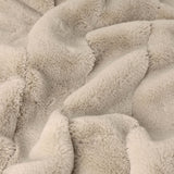 Empress Plain Faux Fur Throw in Oatmeal, shown close-up with a dense, plush pile in soft off-white folds and gathers.