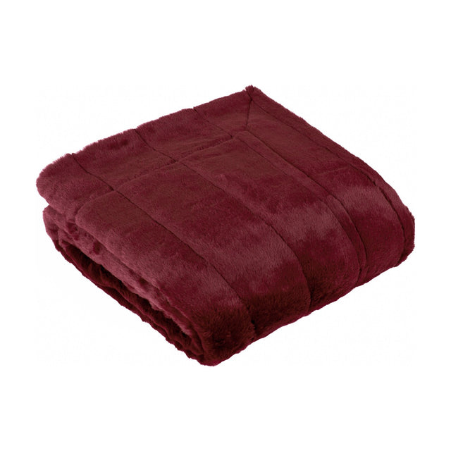 Empress Velvet Faux Fur Throw in ruby red, folded to show its plush, ribbed pile texture, shown on a plain white background.