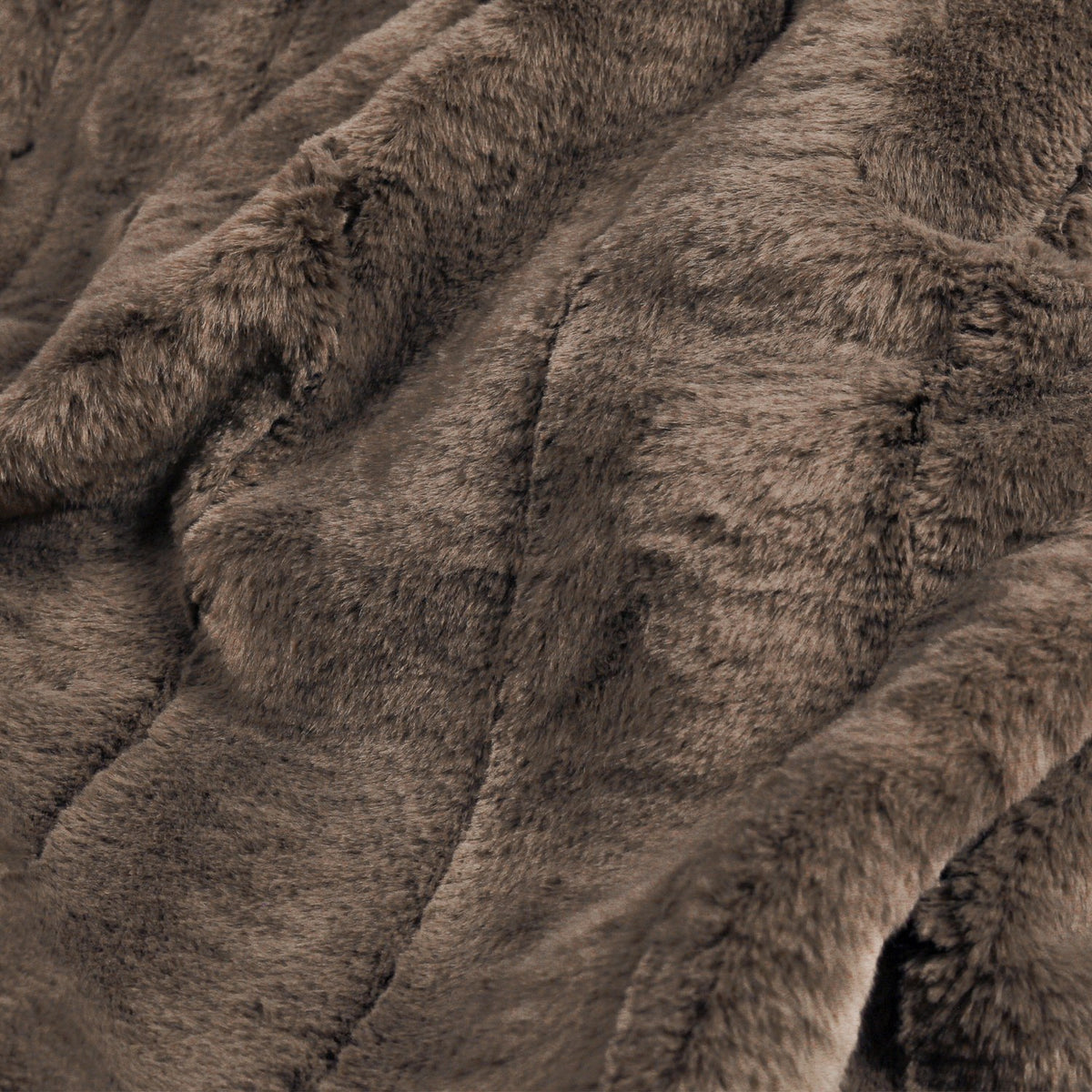Close-up of the Empress Velvet Faux Fur Throw in taupe brown, showing dense channelled pile fabric in a soft, rustic finish.
