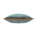 Side view of the Estelle Reversible Velvet Cushion in teal with amber-rust spotted texture and contrast orange piping along the edge, shown on a white background.