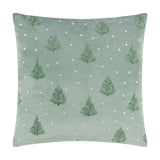 Square mint green velvet cushion with embroidered fir trees and scattered white dots, shown on a plain white background.