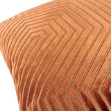 Close-up of the Evoke Geometric Velvet Cushion in brick orange, showing cut-velvet chevron channels with a golden metallic thread woven through the fabric.