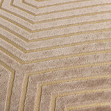 Close-up of the Evoke Geometric Velvet Cushion in beige, showing cut-velvet chevron lines with fine gold threads tracing the channels between the raised pile.