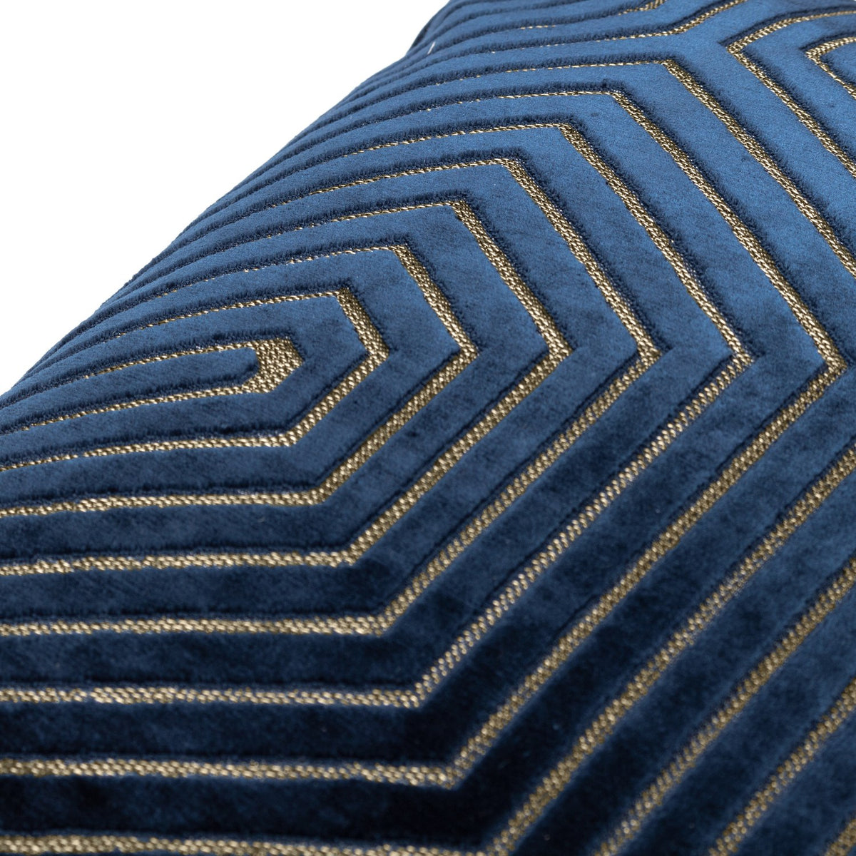 Close-up of the Evoke Geometric Velvet Cushion in navy, showing sculpted chevron velvet lines with metallic gold thread detailing on a plain background.
