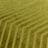Close-up of the Evoke geometric velvet cushion in olive and chartreuse, showing interlocking chevron lines textured into the cut pile fabric.