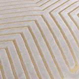 Close-up of the Evoke Geometric Velvet Cushion in pale oyster, showing cut-velvet chevron channels with gold metallic thread detailing along the raised lines.