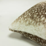 Close-up of the Fawn Animal Faux Fur Cushion's corner, showing brushed pile with brown deerskin-style spotted pattern on a cream ground, against a plain white background.