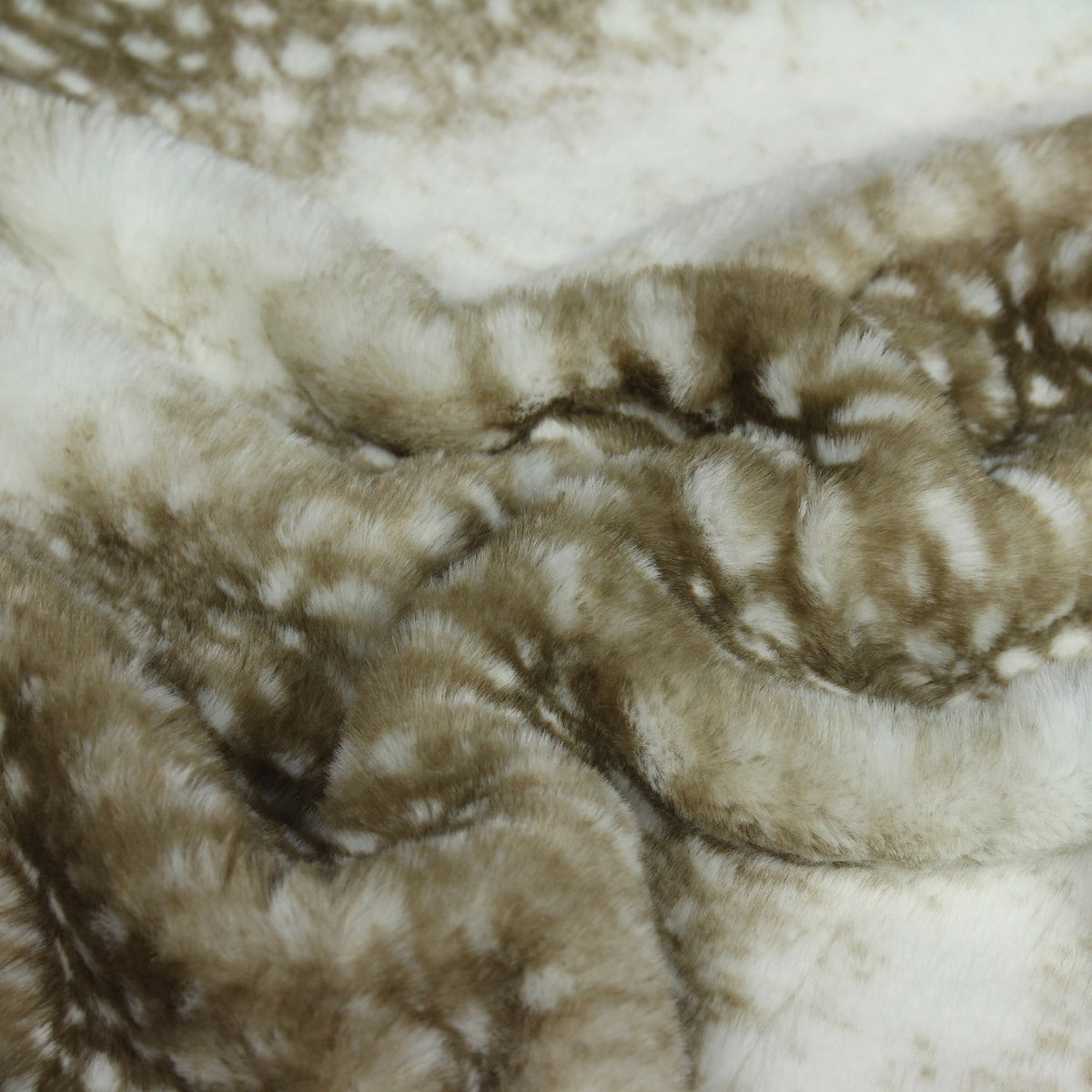 Close-up of the Fawn Animal Faux Fur Throw, showing dappled fawn-print markings in soft browns and cream across a supersoft polyester pile.