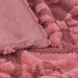 Close-up of the Fur Boucle Big Bows Velvet Faux Fur Throw in dusky pink, showing the smooth velvet reverse against the raised bow-textured boucle and shaggy faux fur front.