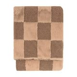 Folded faux fur throw in Chocolate Truffle, featuring a checkerboard mix of smooth fur and curly boucle squares in cocoa and pale beige tones, on a white background.