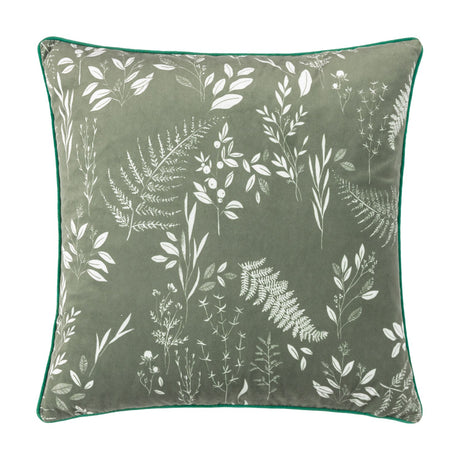 Fearne square velvet cushion in sage green with a hand-drawn white botanical print of ferns, leaves and berries, finished with green piping, shown on a plain white background.