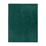 Emerald green polyester fleece throw with an embossed Christmas tree pattern raised across the pile, shown flat against a plain white background.