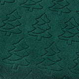 Close-up of the Festive Trees Woodland Polyester Throw in emerald green, showing an embossed Christmas tree pattern raised from the soft fleece pile.