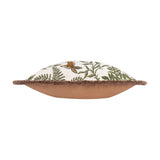 Side view of the Fable Fox and Deer Woodland cushion, showing cream cotton front with green fern embroidery, caramel-brown reverse, and fringed edge, on a white background.