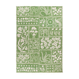 Forage Garden Floral Polyester Rug in sage green, patchwork grid of cream floral, fern, mushroom and peacock motifs on a flatweave base, shown on a plain white background.