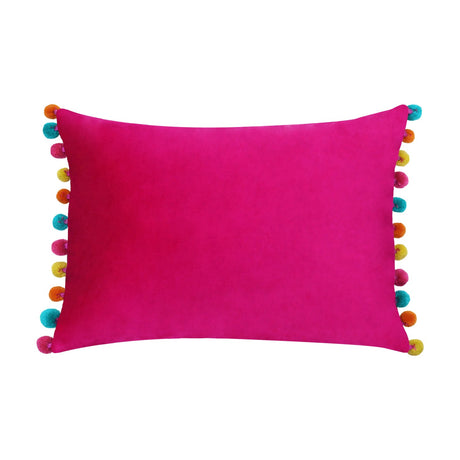 Fiesta rectangular cushion in plain hot pink velvet with multicoloured pompoms in orange, yellow and teal along both short edges, shown on a white background.