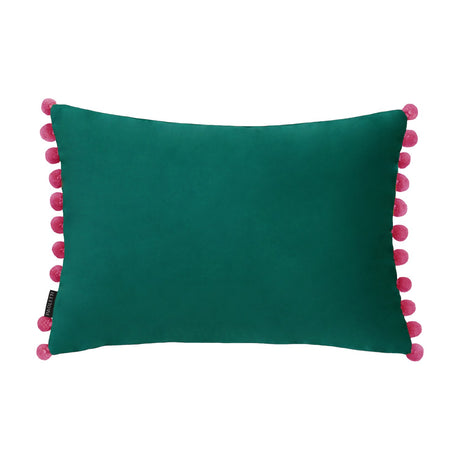 Fiesta Plain Velvet Cushion in deep teal with contrasting berry pink pompom trim, rectangular bolster shape, shown on a plain white background.