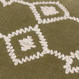 Close-up of the Folis Geometric Cotton Cushion in khaki, showing cream embroidered diamond motifs and zig-zag stitching on woven cotton fabric.