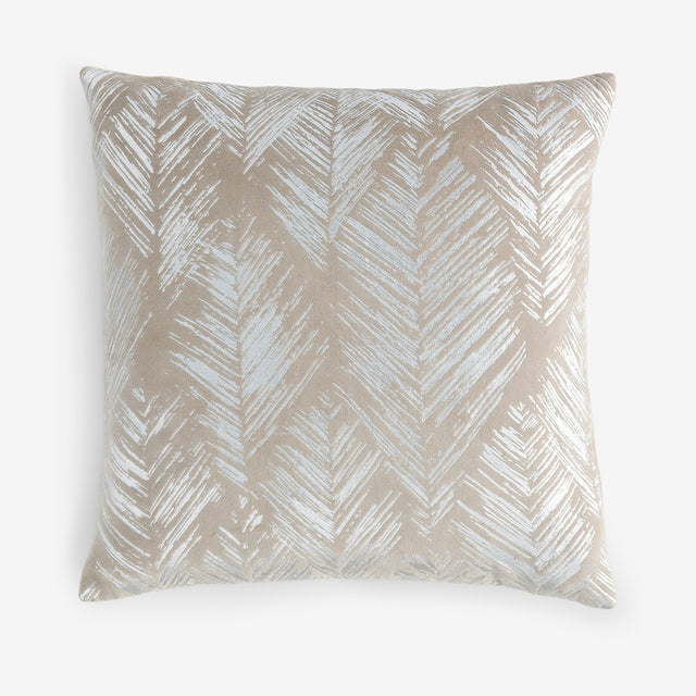 Folius Velvet Cotton Cushion in Silver, a square 43 x 43cm cushion with a foil-printed leaf herringbone pattern in pale silver on a warm neutral velvet ground, shown on a plain white background.