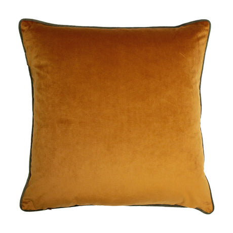 Square rust-gold velvet cushion with olive-grey piped edging, plain reverse side shown on a white background.