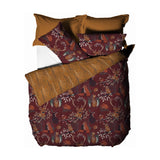 Forest Fauna Woodland Animal Duvet Cover Set in rust, featuring a printed stag, fox, owl, hare and squirrel design with reversible rust and gold tree-branch pillowcases, on a white background.