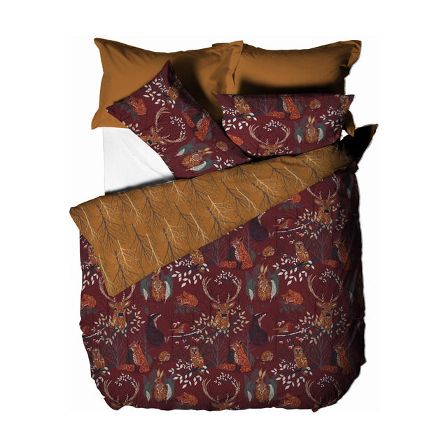 Forest Fauna Woodland Animal Duvet Cover Set in rust, featuring a printed stag, fox, owl, hare and squirrel design with reversible rust and gold tree-branch pillowcases, on a white background.