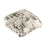 Folded Forest Festivities velvet throw in natural, showing a printed winter woodland scene with pine trees and animals, cream faux fur reverse, on a white background.