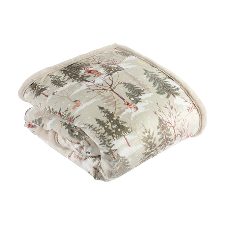 Folded Forest Festivities velvet throw in natural, showing a printed winter woodland scene with pine trees and animals, cream faux fur reverse, on a white background.