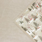 Forest Festivities Velvet Faux Fur Throw in Natural, folded corner showing printed winter woodland scene with trees and animals against cream faux fur reverse.