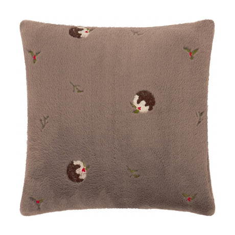 Square faux fur cushion in mocha brown, embroidered with Christmas pudding motifs and holly sprigs, shown on a plain white background.