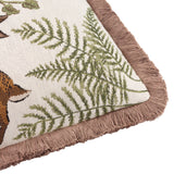 Close-up of the Fable Rabbits Woodland cotton cushion corner in willow green, showing fern and rabbit motif on cream fabric with brown fringe trim edging.