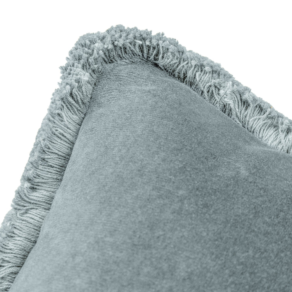 Close-up of the Freya Plain Velvet Cushion in Duck Egg, showing soft blue-grey velvet with a fringed edge trim, on a plain white background.